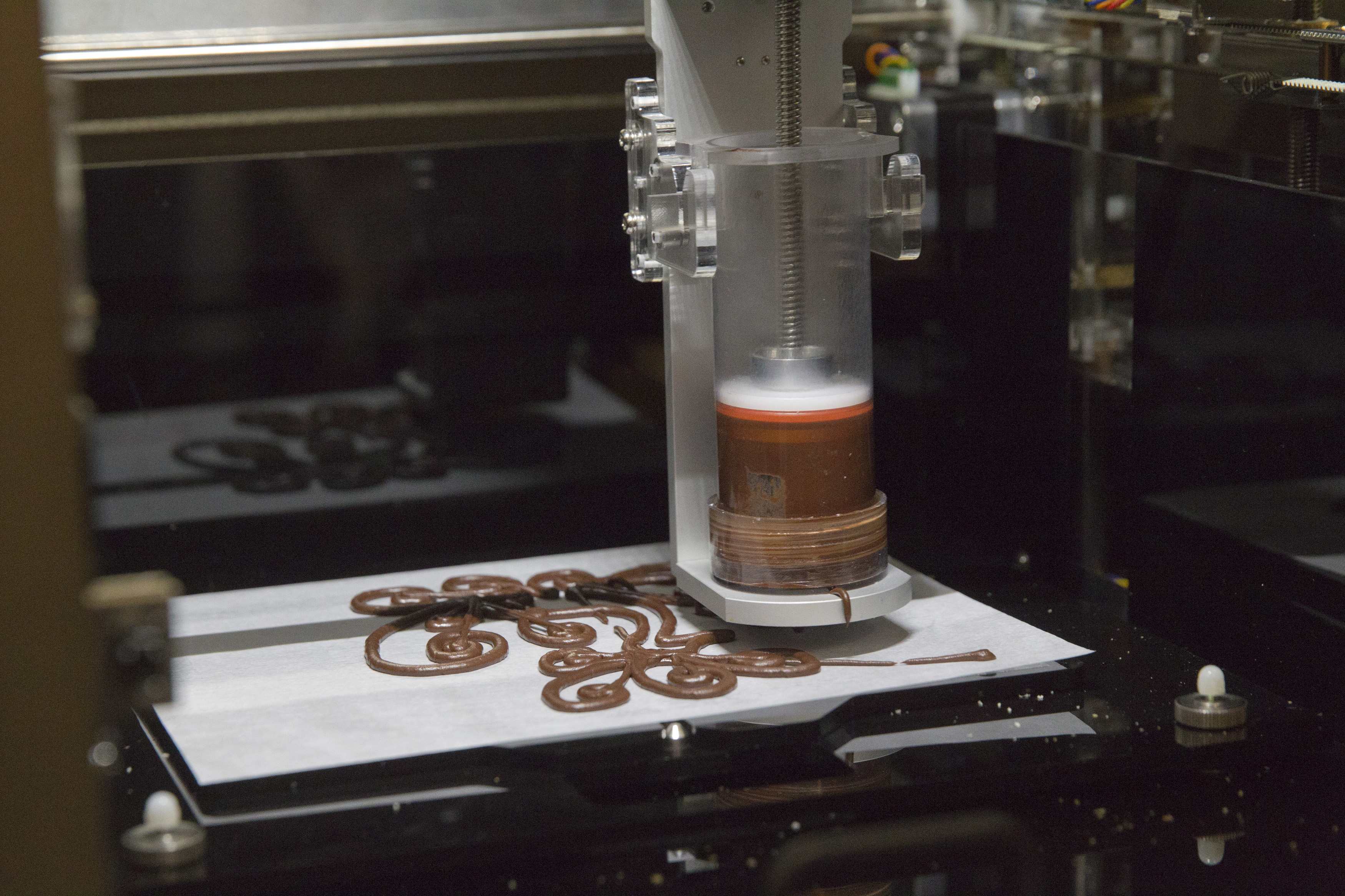 A 3D food printer by XYZprinting Inc. is demonstrated during the 2015 International Consumer Electronics Show (CES) in Las Vegas, Nevada January 4, 2015. The printer is expected to be available in the third quarter of 2015 but a price has not yet been established, a representative said. REUTERS/Steve Marcus (UNITED STATES - Tags: SCIENCE TECHNOLOGY BUSINESS FOOD)